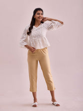 Load image into Gallery viewer, Go Colors Light Gold Poly Modal Cropped Metallic Pants
