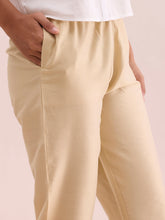 Load image into Gallery viewer, Go Colors Dark Cream Poly Modal Metallic Pants
